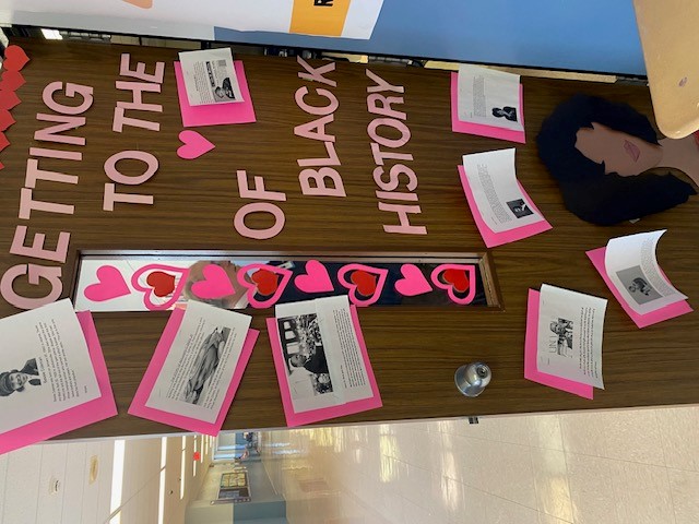 Photo of a door decorated with write-ups of famous African Americans and cutout text spelling "Getting to the Heart of Black History"